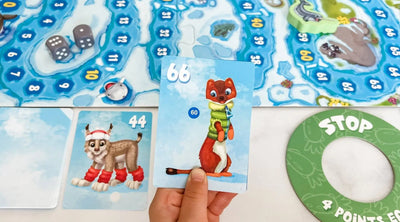 Photo of child playing self-check addition and subtraction math game Arctic Riders
