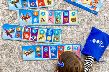Child playing letter recognition game, Rooby's ABCs