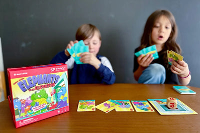Two kindergarten kids playing math counting on game, Elephants in an Elevator.