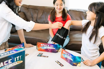 Mom and daughters playing math game for 4th graders SpaceIt!