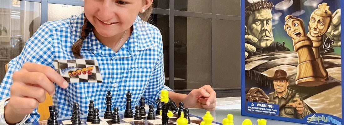 A child playing SimplyFun's Chess on the Loose board game
