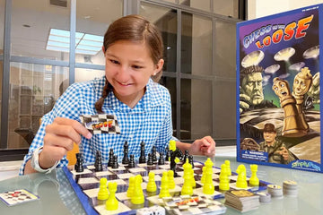 Girl playing three-in-one chess monster strategy board game.