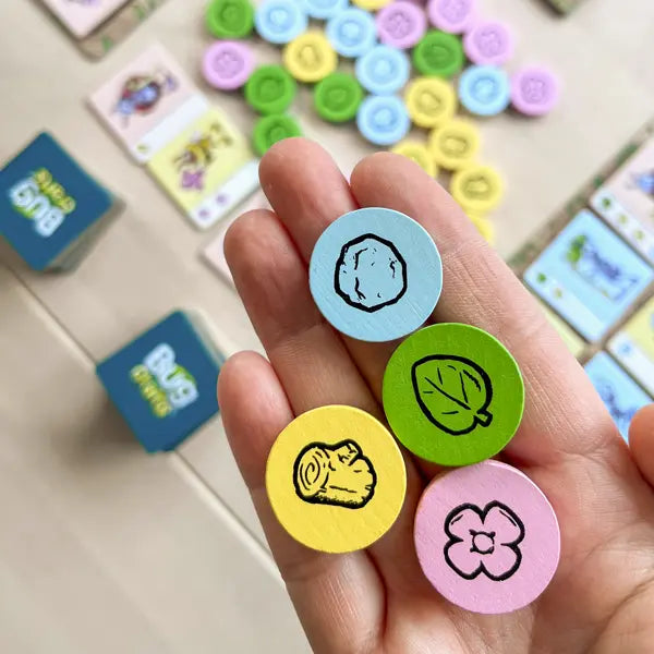 Bug Crafts is a resource management board game where kids ages 8+ plan and trade materials at a bug market to craft goods for their bug friends.-SimplyFun