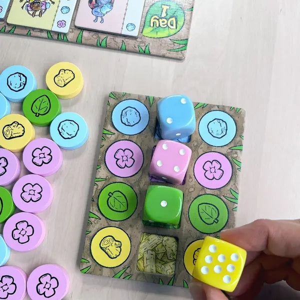 Bug Crafts is a resource management board game where kids ages 8+ plan and trade materials at a bug market to craft goods for their bug friends.-SimplyFun