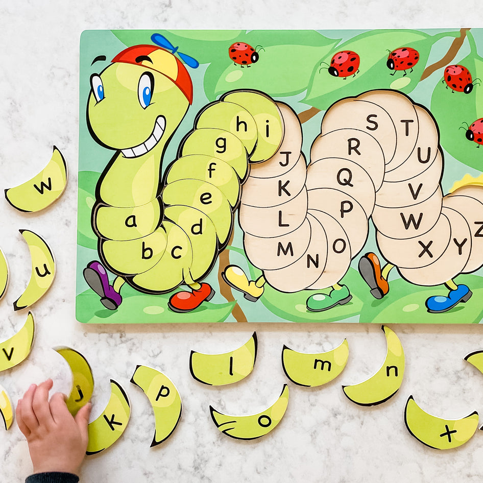 Tibbar's Little Hands, Big Smiles by SimplyFun is a set of three puzzles focusing on shapes, colors, lowercase and uppercase letters, and counting.