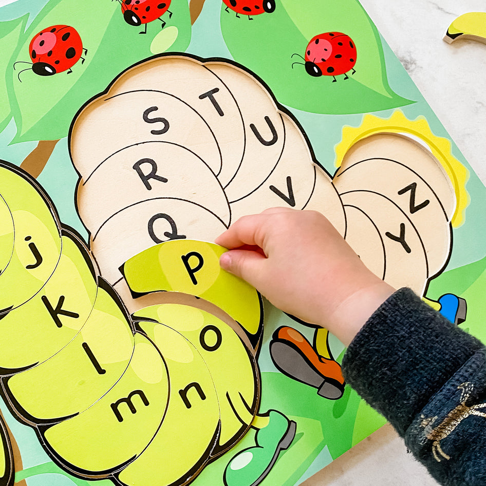 Tibbar's Little Hands, Big Smiles by SimplyFun is a set of three puzzles focusing on shapes, colors, lowercase and uppercase letters, and counting.