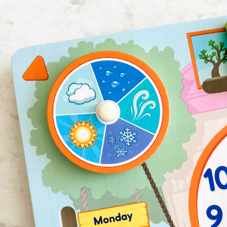 My Fun Day by SimplyFun is a wooden board designed to teach children about the weather, days of the week, months, and more.