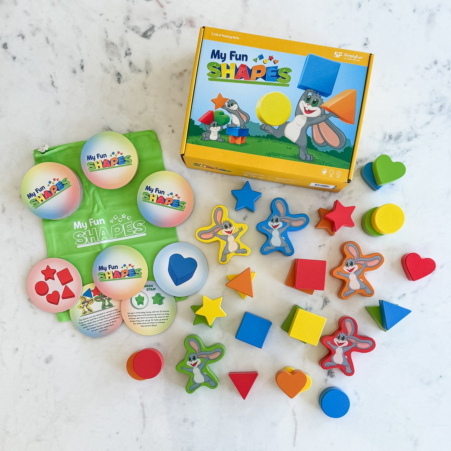 My Fun Shapes by SimplyFun. 30 wooden blocks and disc cards to aid in learning colors and shapes, and practicing fine motor skills.-SimplyFun