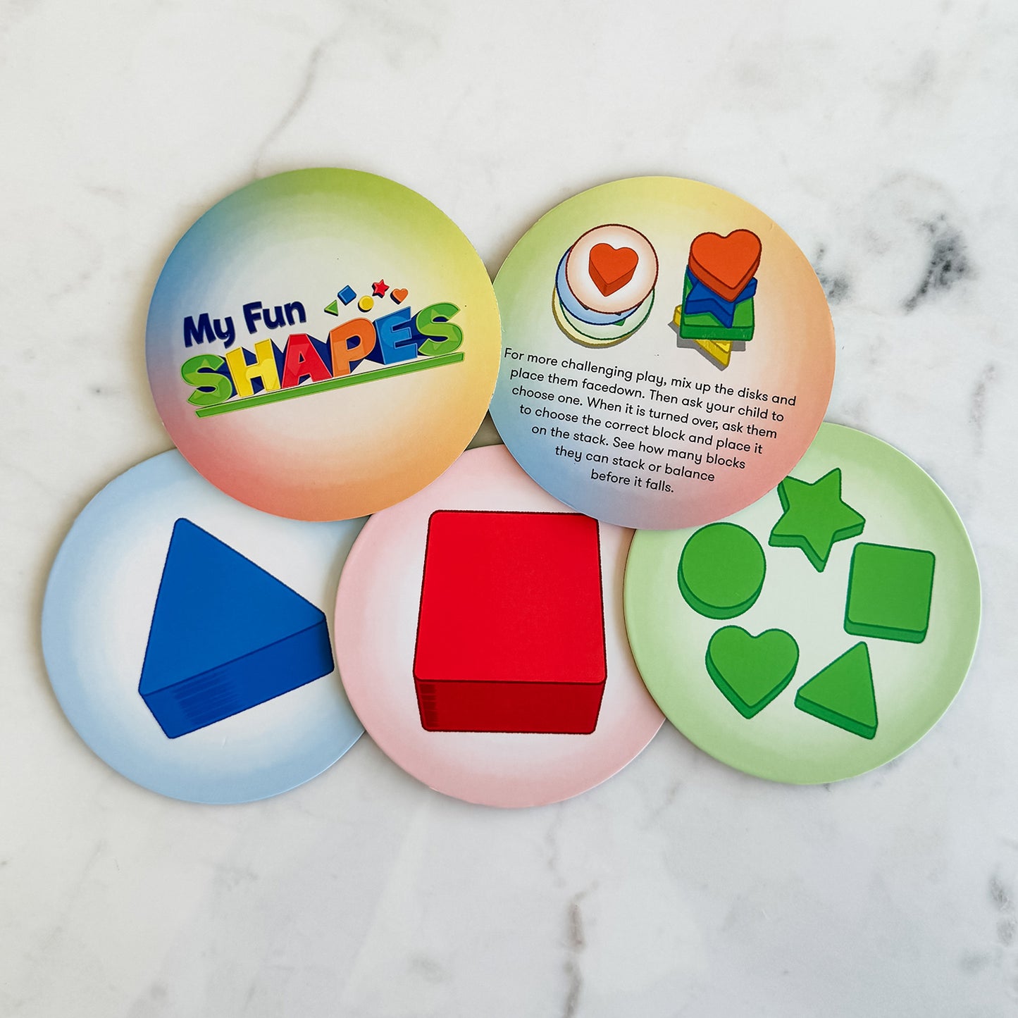 My Fun Shapes by SimplyFun. 30 wooden blocks and disc cards to aid in learning colors and shapes, and practicing fine motor skills.-SimplyFun