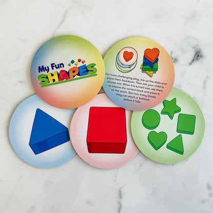 My Fun Shapes by SimplyFun. 30 wooden blocks and disc cards to aid in learning colors and shapes, and practicing fine motor skills.