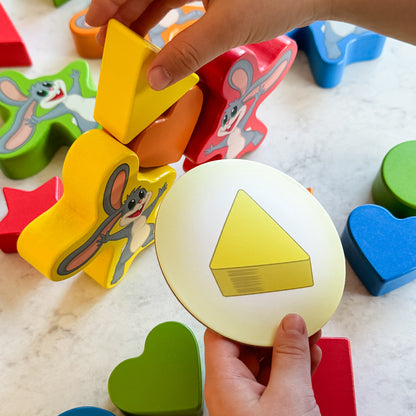 My Fun Shapes by SimplyFun. 30 wooden blocks and disc cards to aid in learning colors and shapes, and practicing fine motor skills.