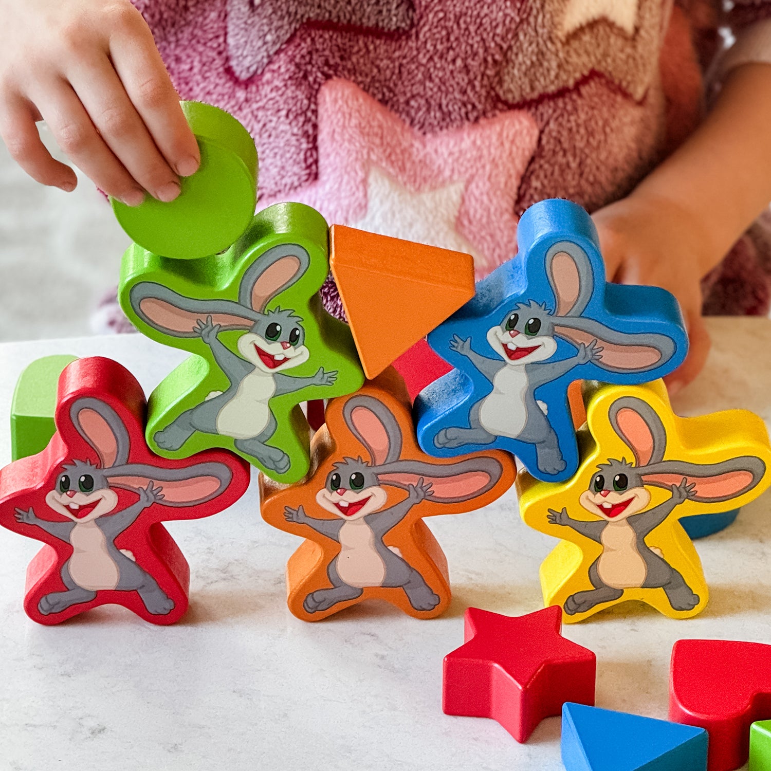 My Fun Shapes by SimplyFun. 30 wooden blocks and disc cards to aid in learning colors and shapes, and practicing fine motor skills.