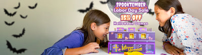 Two children playing with a purple and yellow board game labeled 'Mirror Mansion' on a table, with promotional text reading 'Spooktacular Labor Day Sale' and '15% Off Halloween Games' over a light gray wall with black bat silhouettes.