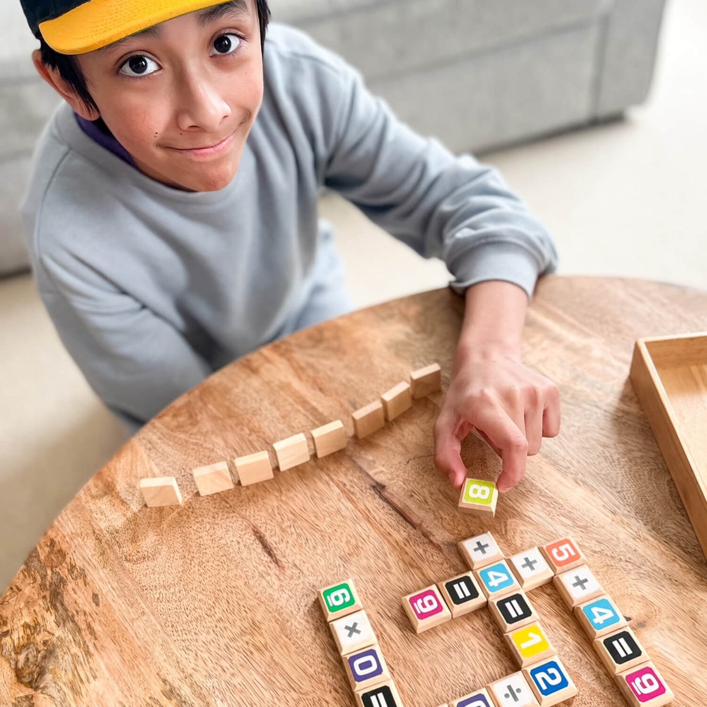 Sumology by SimplyFun is a fun math game focusing on addition, multiplication, subtraction, and division. It's like scrabble for math.