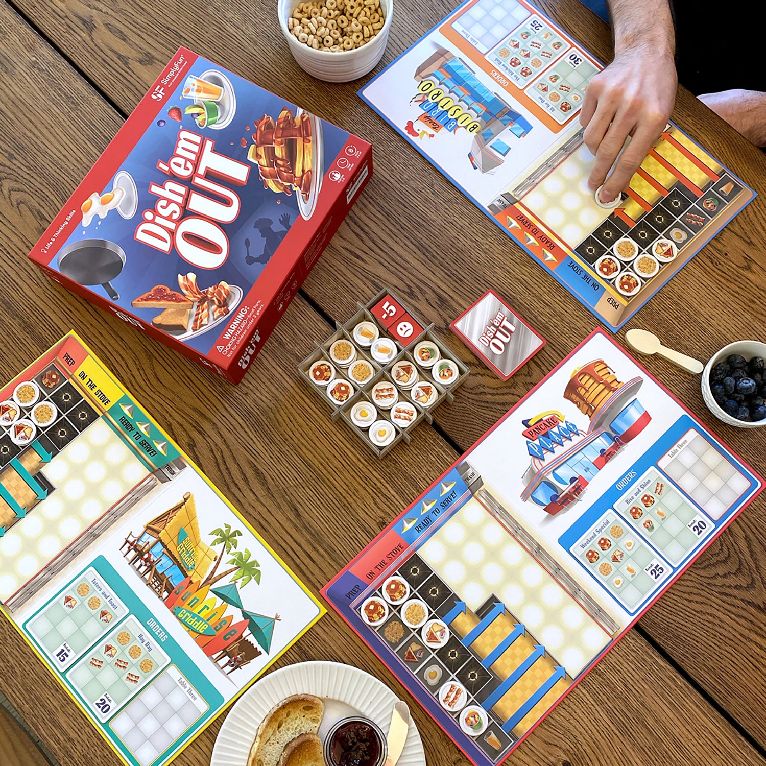 Dish 'em Out by SimplyFun is a fun restaurant and diner strategy game for ages 8 and up
