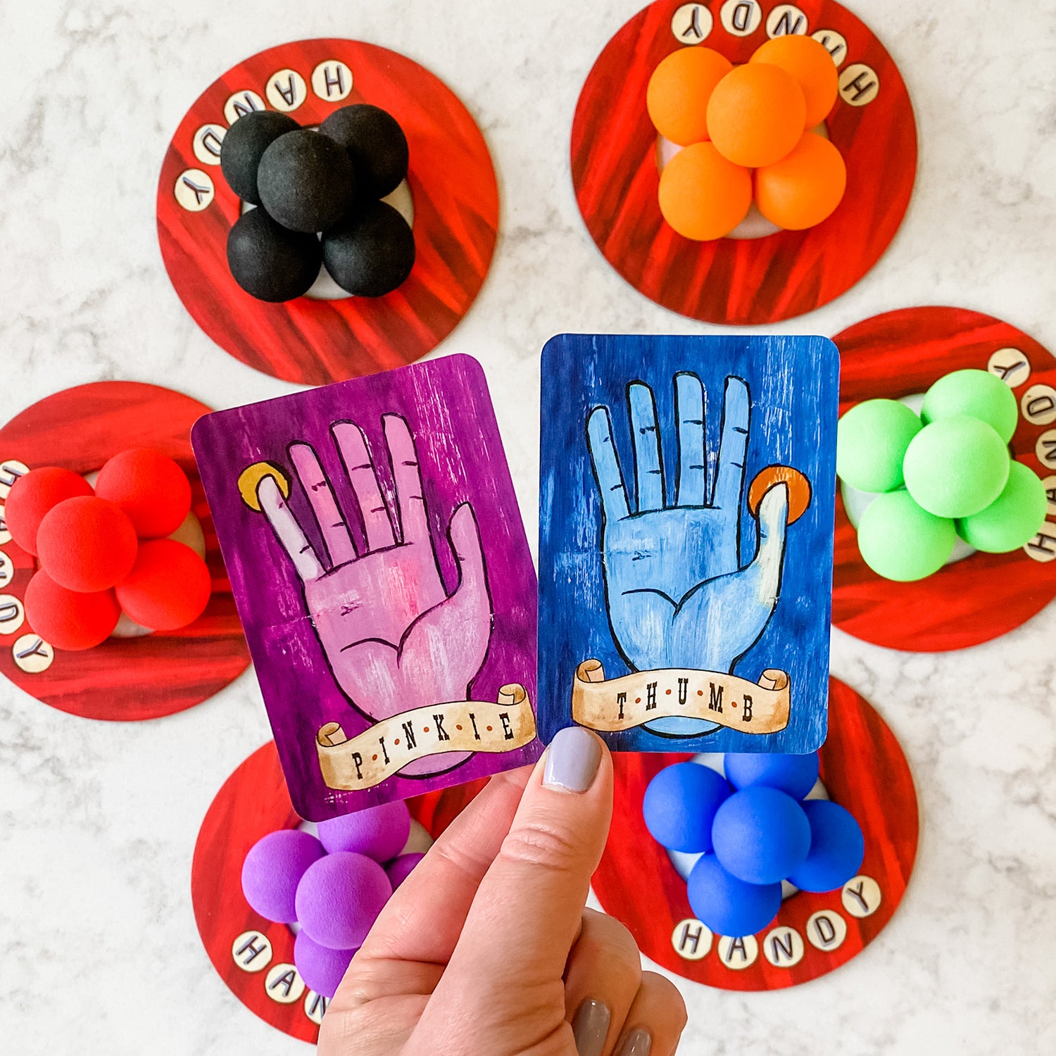 Handy by SimplyFun is a fun collaborative game focusing on fine motor skills and teamwork for ages 8 and up.