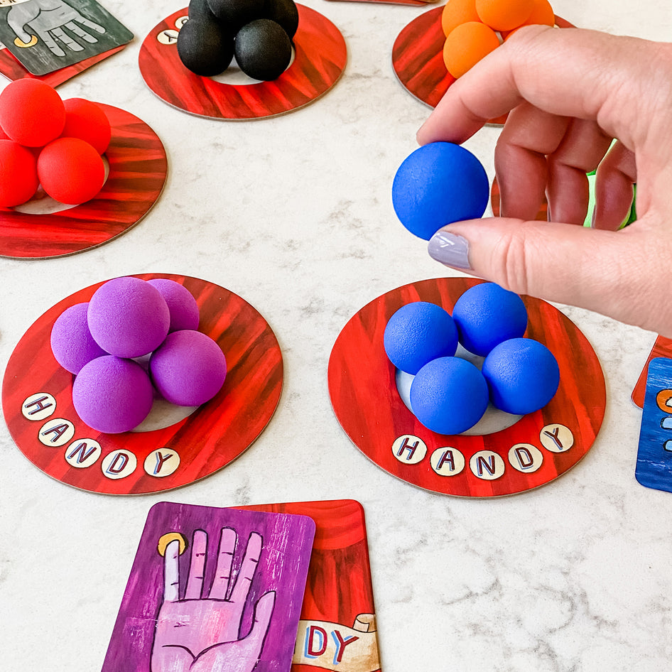 Handy by SimplyFun is a fun collaborative game focusing on fine motor skills and teamwork for ages 8 and up.