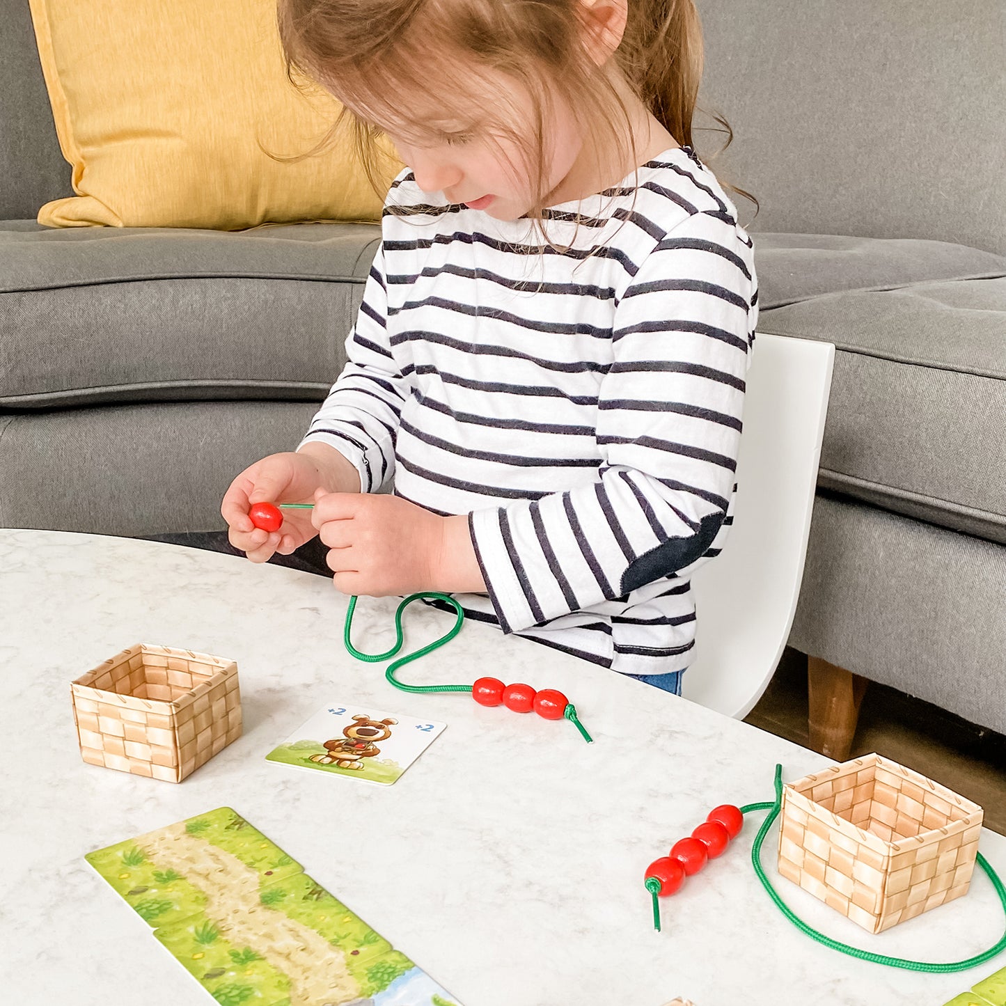 Share a Berry by SimplyFun is an early counting game and fine motor skills game for ages 3 and up.